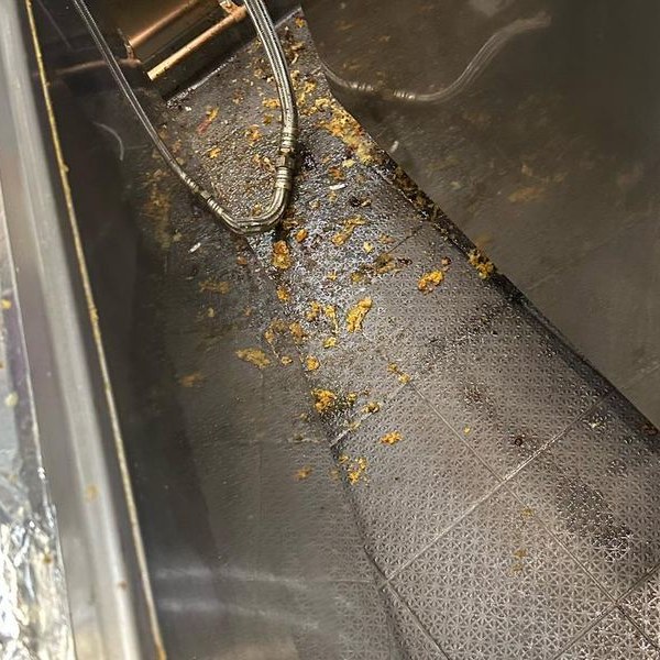 Commercial kitchen floor and equipment after cleaning service
