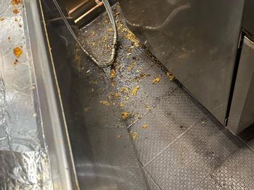 Commercial kitchen floor and equipment after cleaning